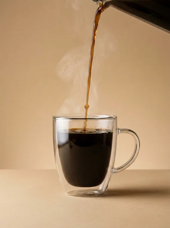 Glass mug with a fresh espresso pour